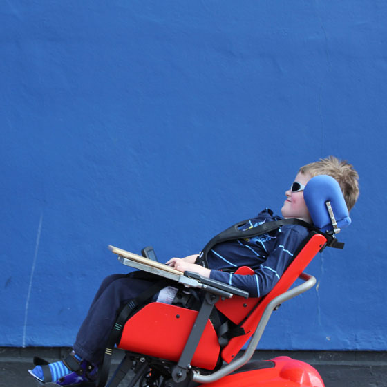 Boy in electric wheelchair