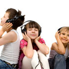 Three children listening to audiobook